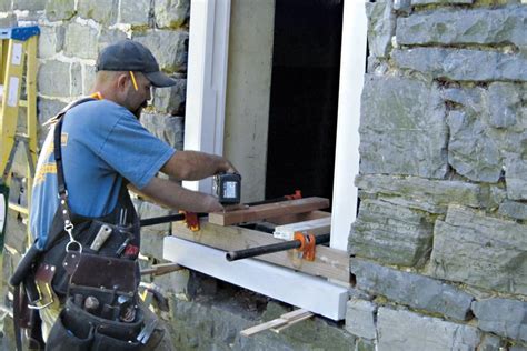 windows on a historic stone house porch with metal mullins|18th century stone house windows.